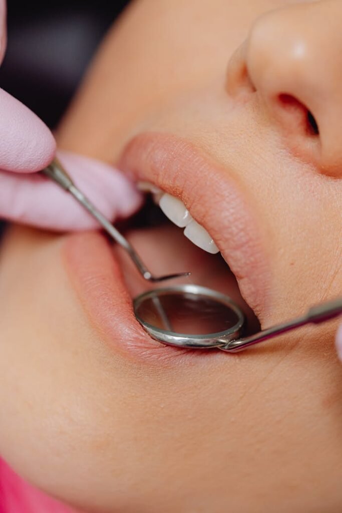 Close-up of Dental Tools in a Patient's Mouth
